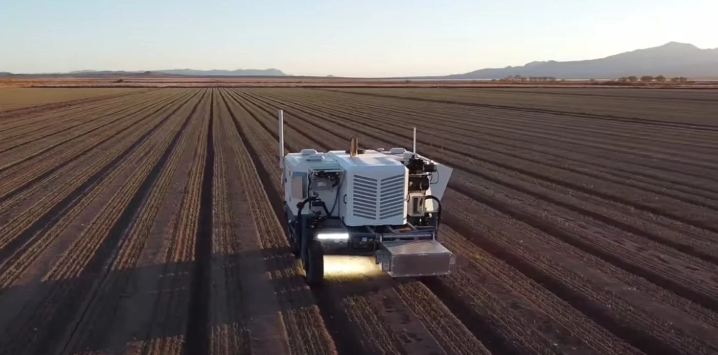 An inspection and sprayer drone patrolling a field.