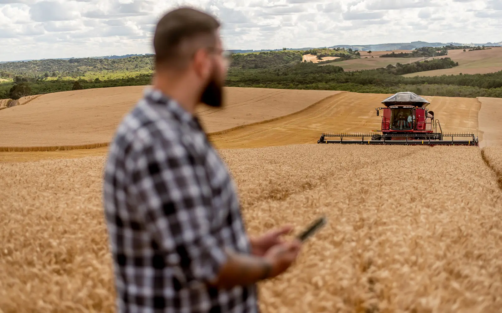 A computer-guided precision combine harvester in action.